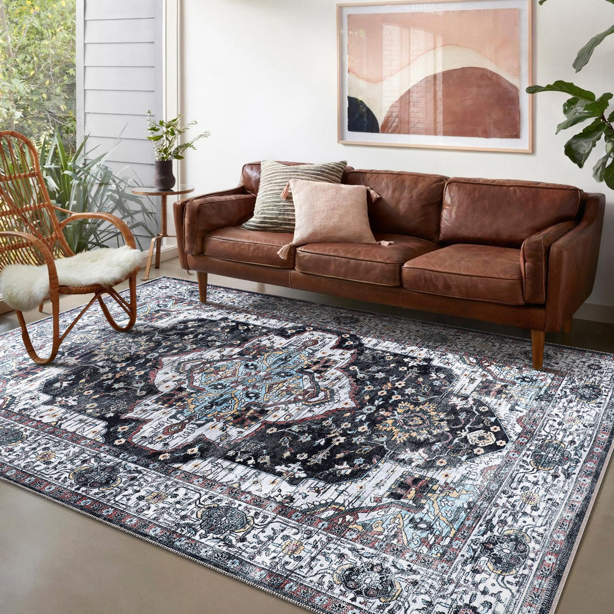 Machine washable Persian medallion rug by Netline Home, vintage black and white oriental carpet with blue accents for living room or bedroom.