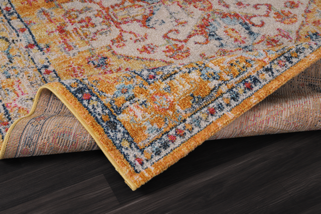Vintage Netline Home area rug with bohemian mustard and rust patterns, featuring intricate design and textured fabric.