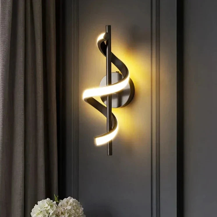 Black and gold Twisted LED wall light by Light My House, designed for modern living room decor, featuring a sleek, sculptural design.