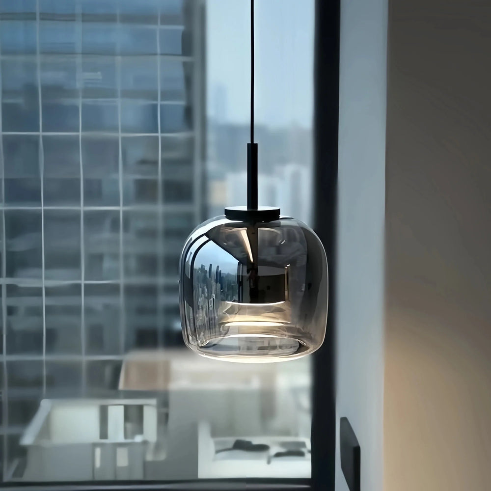 Black and gold pendant lamp by Light My House with LED warm light, adjustable height and modern design.