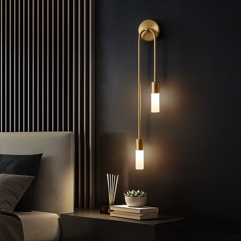 Modern metal Spire Sleek LED wall light by Light My House with 12W warm white G9 bulb, mounted on a wall for ambient lighting.