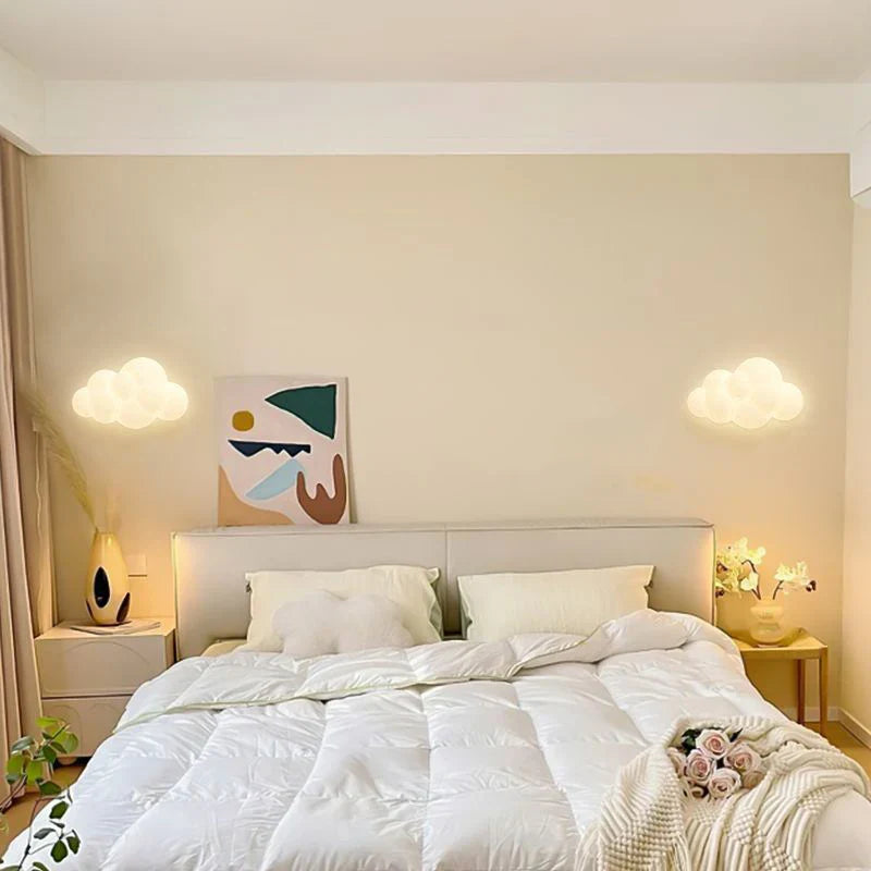 Remote control Cloud Wall Lamp by Light My House with adjustable LED light temperature and modern cloud design.