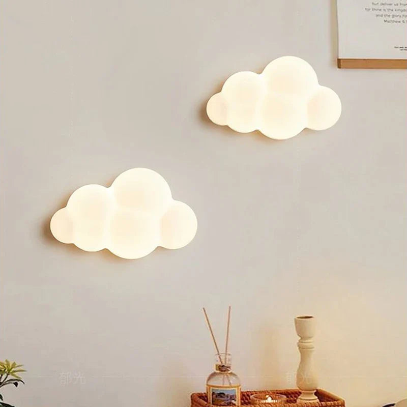 Remote control Cloud Wall Lamp by Light My House with adjustable LED light temperature and modern cloud design.