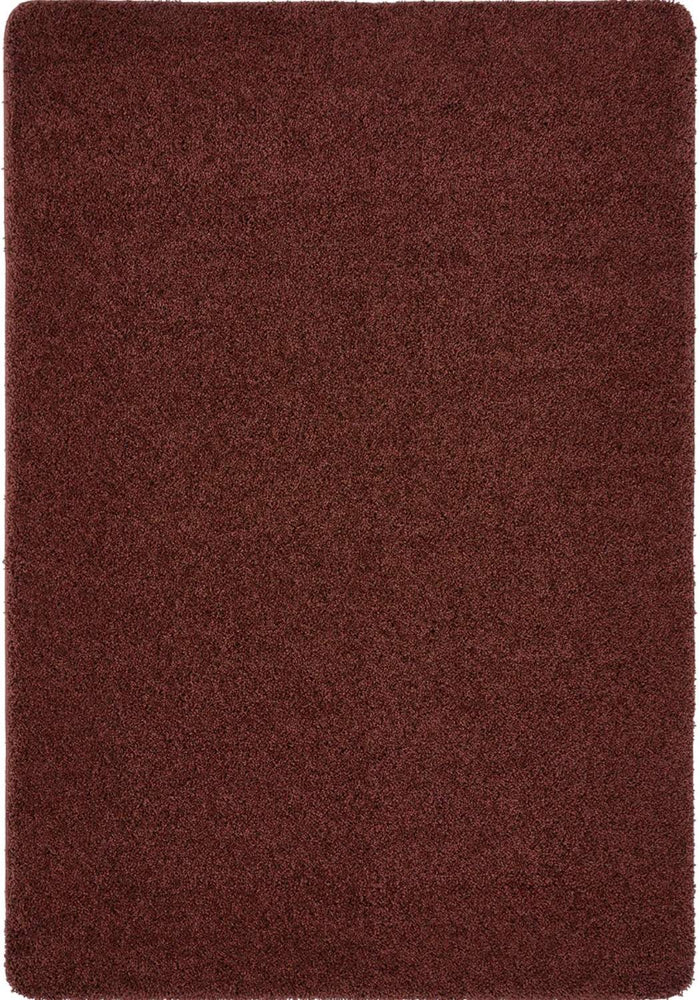Washable Ox Red Shaggy Rug shown in an illustrative room