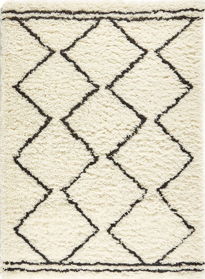 Berber Cream/Black Wool Shaggy Rug shown in an illustrative room