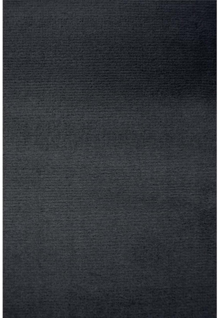 Maestro Solid Dark Grey Rug shown in an illustrative room