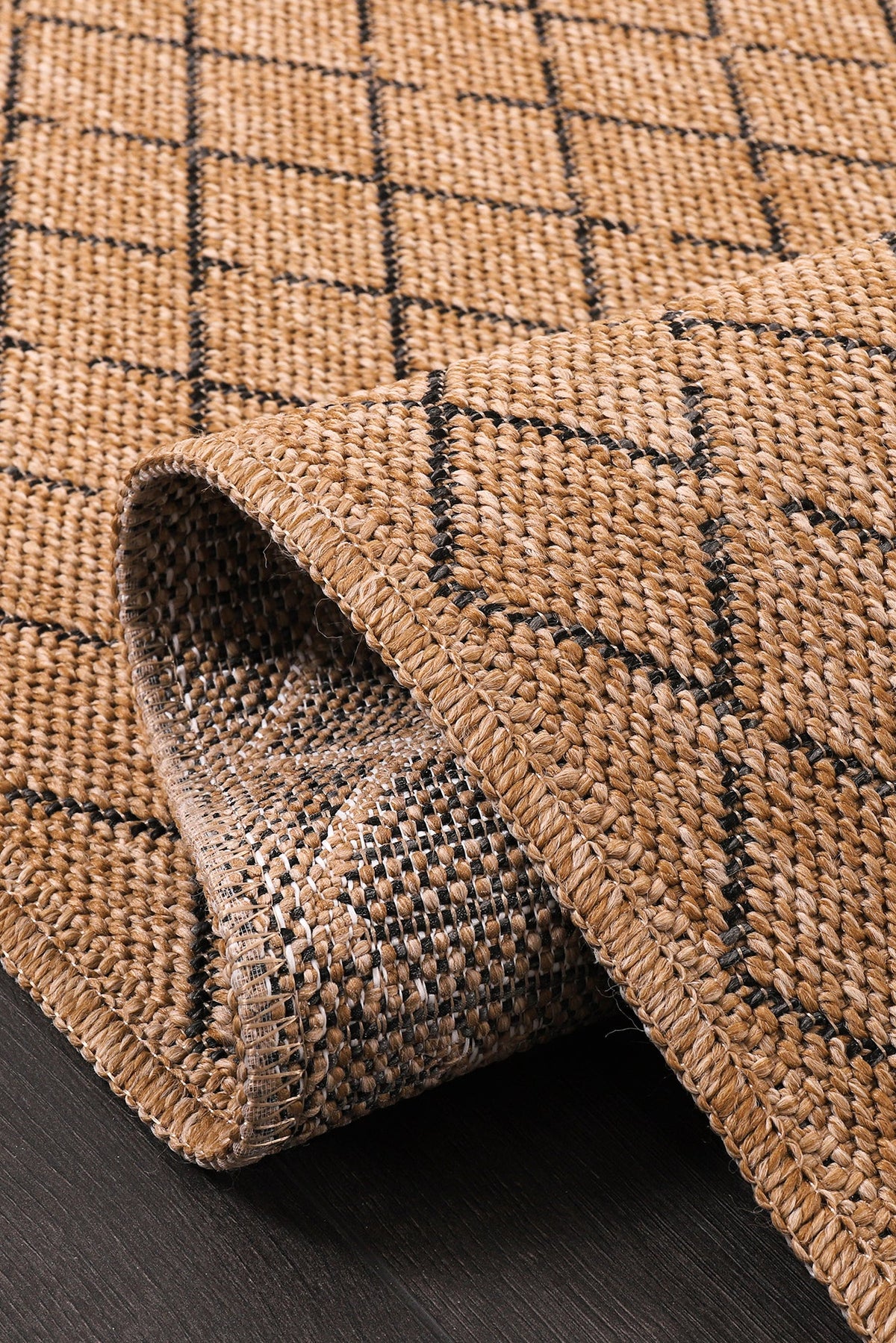 Diamond Weave Jute-Effect Rug by Netline Home, natural indoor-outdoor washable rug with black geo pattern and non-slip, weatherproof design.