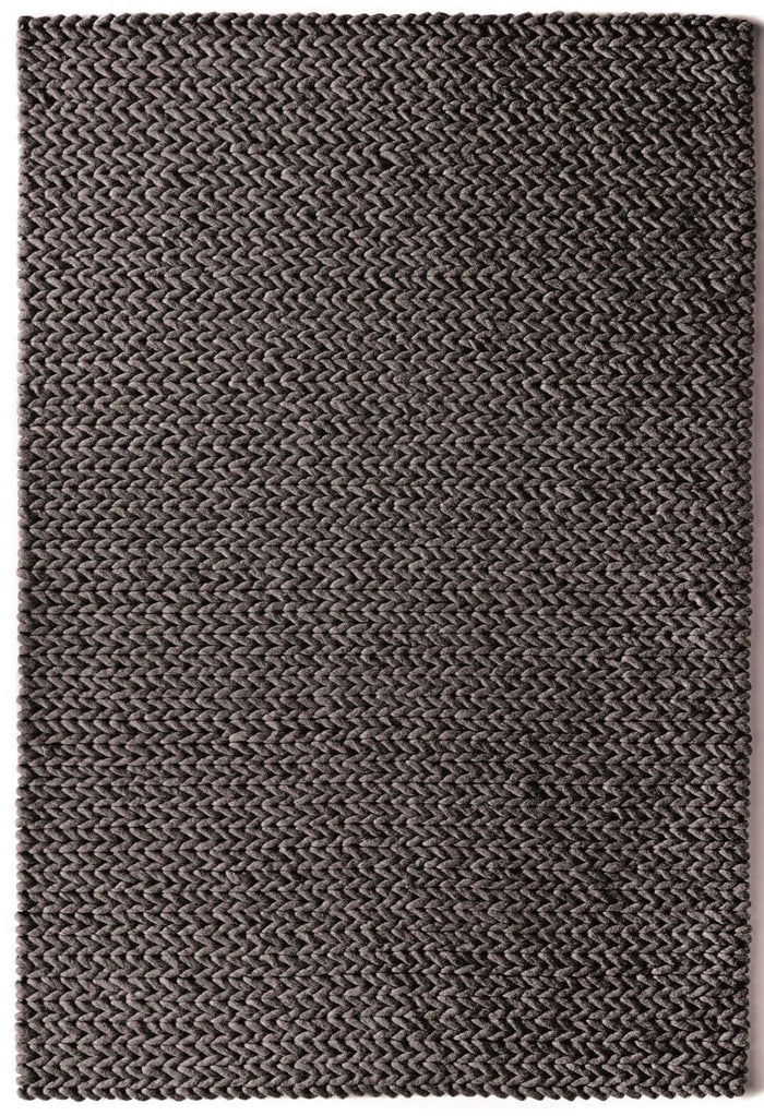Fusion Dark Grey Braided Wool Rug shown in an illustrative room