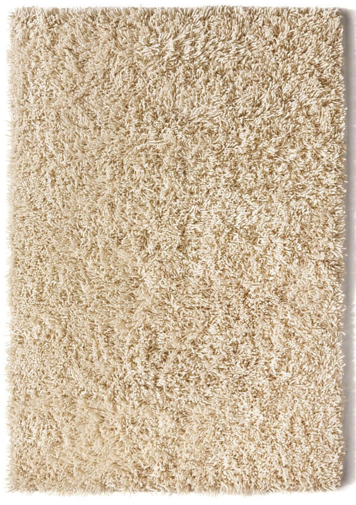 Imperial Ivory Shaggy Pile Wool Rug shown in an illustrative room