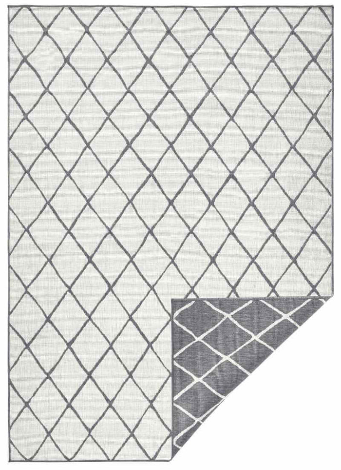Reversible Indoor-Outdoor Geometric Flatweave Rug shown in an illustrative room