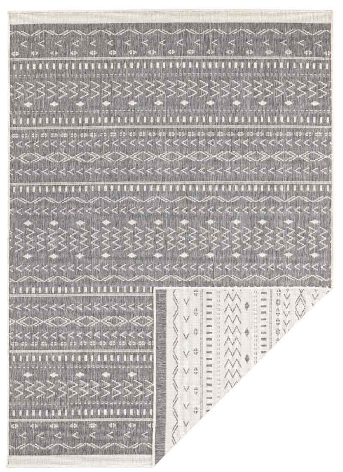 Kuba Reversible Indoor-Outdoor Rug shown in an illustrative room