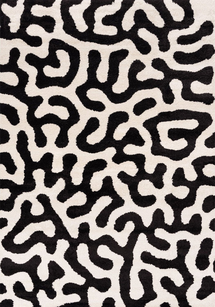Joli Doodle Black & White Rug shown in an illustrative room