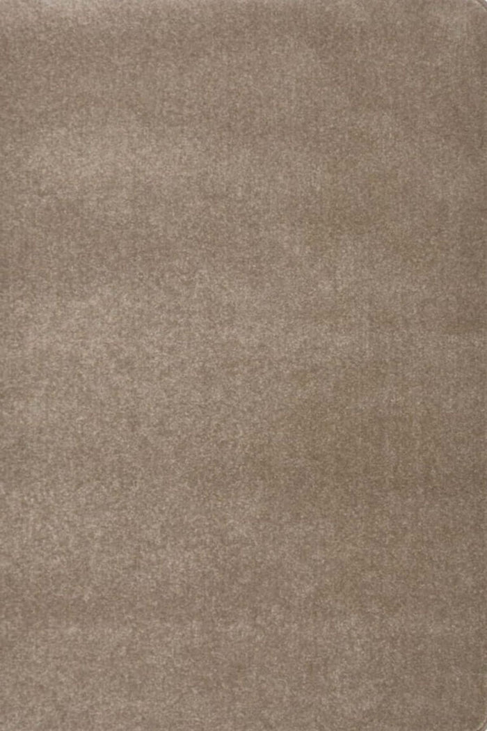 Relay Brown Recycled Low Pile Rug shown in an illustrative room