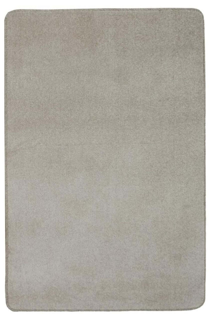 Relay Beige Recycled Low Pile Rug shown in an illustrative room